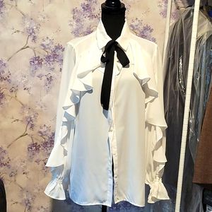 Long sleeved white collar, button down ruffled blouse w/black attached tie.